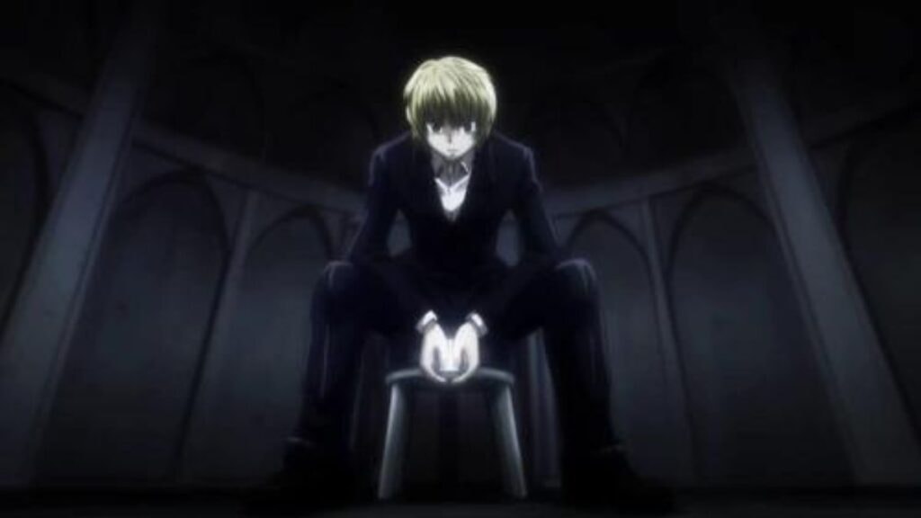 Kurapika portant un costume dans Hunter x Hunter