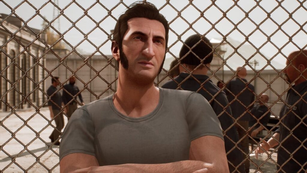 Leo Caruso adossé au grillage d'une prison dans le jeu vidéo A Way Out